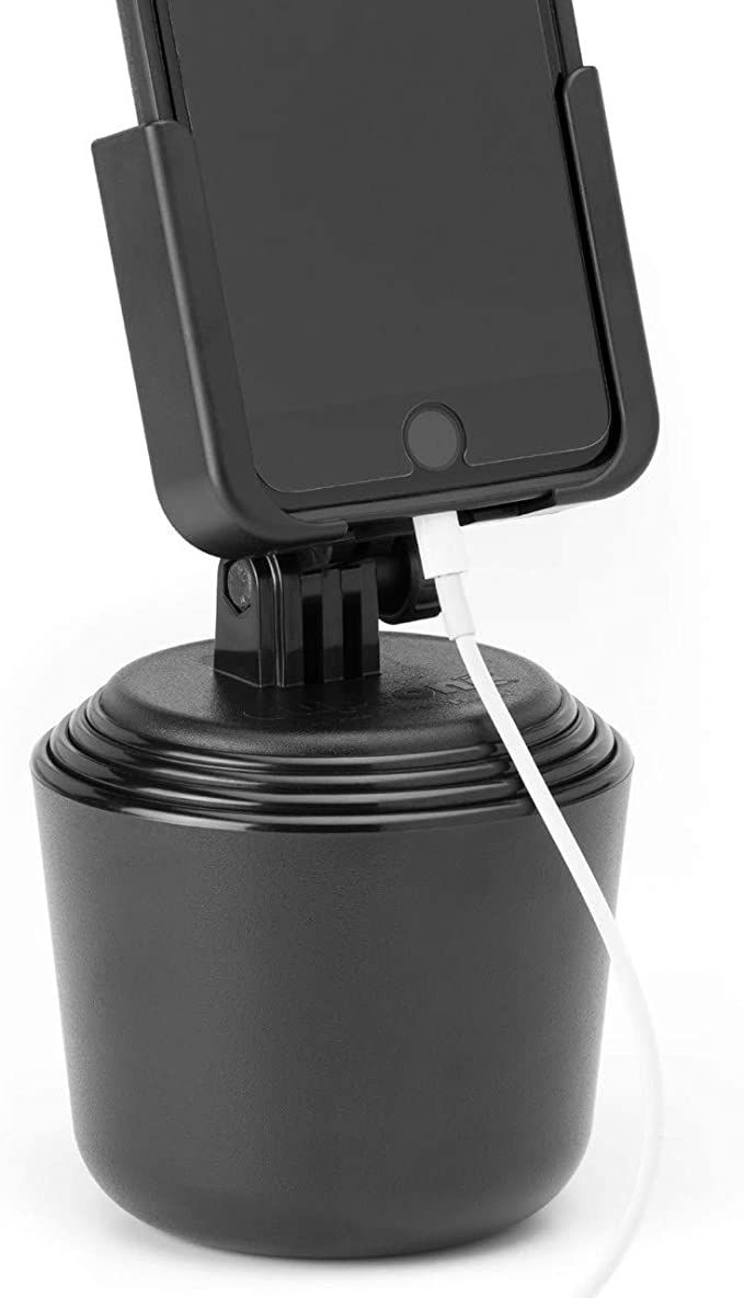 an image of a cell phone holder attached to a device on top of a cup