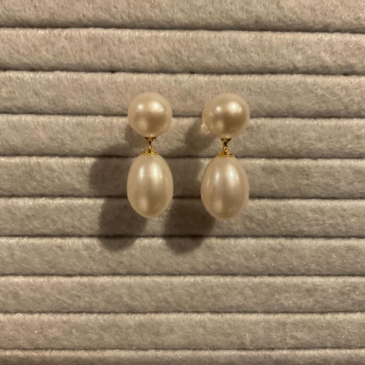 Dainty white pearl earrings.  1 inch length.  Materials:  Pearl Beautiful 8mm round pearls and 12mm teardrop freshwater pearls have a lovely shine.  These are dainty 1 inch pearl earrings.  These are minimalist earrings and are perfect for wedding and bridal and special occasions.  Pearls are always the perfect romantic gift! Packaged in a complimentary silk brocade jewelry pouch. Free Shipping - Pearlcore Trending Jewelry Minimalist Pearl Drop Earrings For Formal Occasions, Teardrop Pearl Pendant Earrings For Formal, Formal Drop Earrings With Pearl Pendant, Formal Drop Pearl Pendant Earrings, Formal Drop Pearl Earrings, Formal Pearl Charm Earrings, Formal Minimalist Pearl Earrings With Charm, Formal Pear-shaped Pearl Charm Earrings, Formal Pearl White Drop Earrings