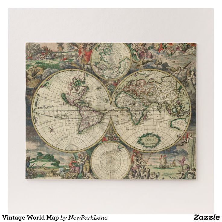 an old world map hanging on the wall in front of a white wall with a wooden frame