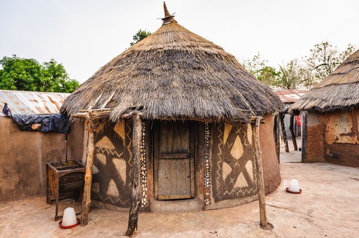 an african village with thatched roofs and mud huts