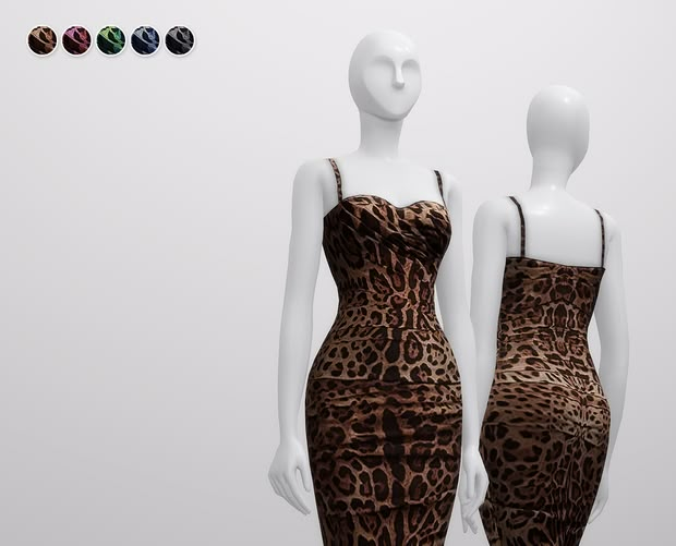 two female mannequins dressed in leopard print clothing, one wearing a brown dress