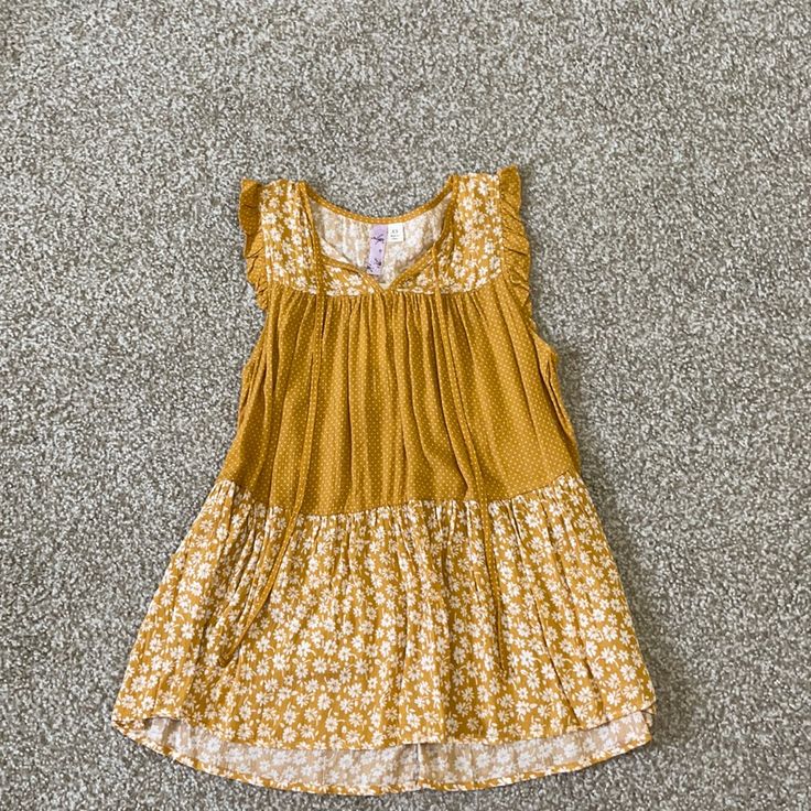 Women Sleeveless Top. Its Brand New With Tags. Marigold Color Size Xs Chic Gold Tank Top For Spring, Yellow Sleeveless Summer Tops, Flowy Sleeveless Tank Top For Spring, Flowy Sleeveless Summer Tops, Casual Flowy Sleeveless Top, Yellow Sleeveless Blouse Tank Top For Spring, Yellow Sleeveless Blouse For Spring, Flowy Sleeveless Casual Tops, Casual Sleeveless Gold Dress