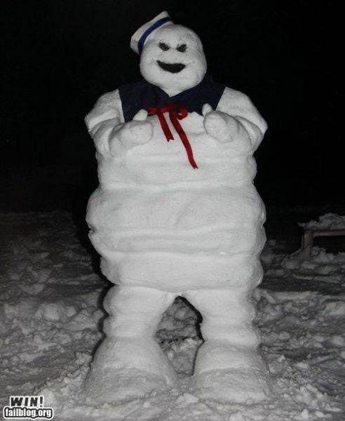 a snow man is standing in the snow