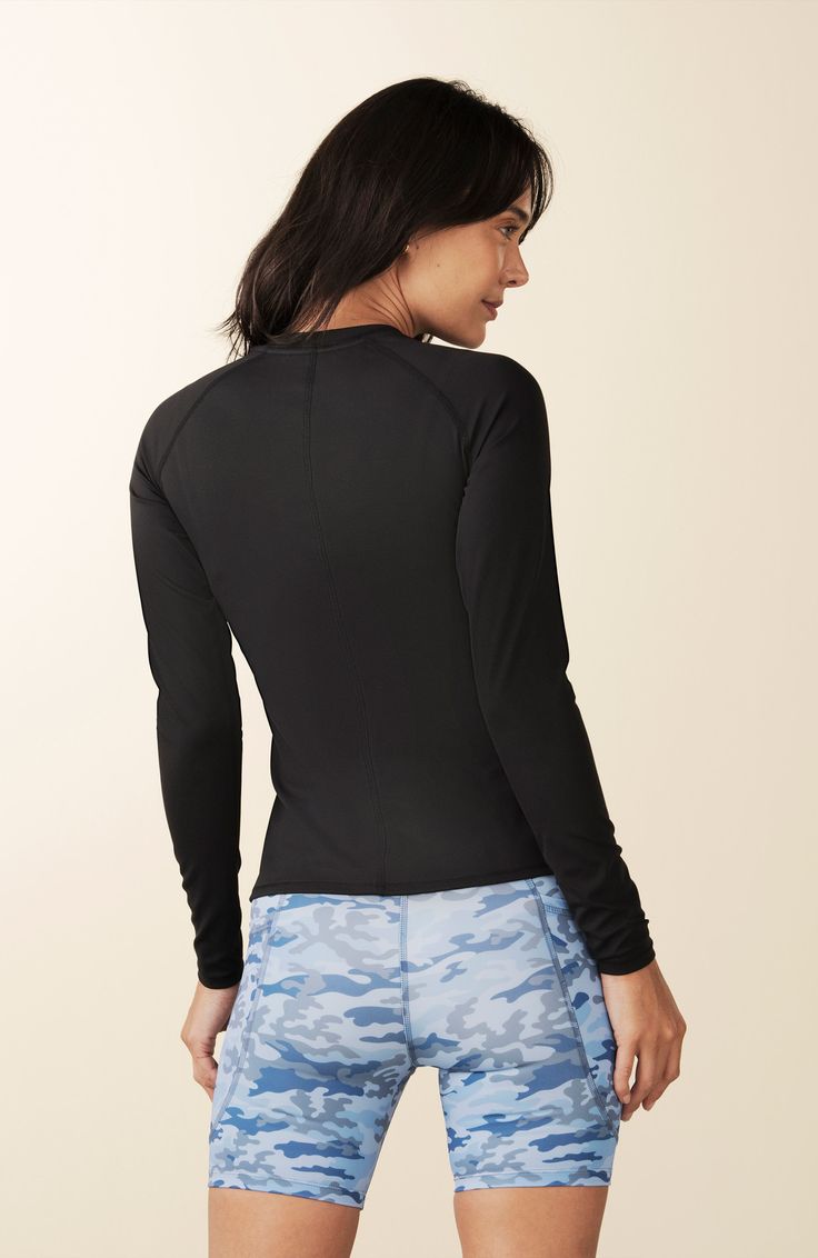 Streamlined Long Sleeve Top, a lightweight workout layer that's as versatile as it is stylish. Whether you're practicing yoga or embracing an active lifestyle beyond the studio, this top is a forward stunner that effortlessly elevates your look.  At LOSANO we help elevate every moment with clothing that is better for you! Crew neck Curved contrast panels Body skimming Split hem PFA Free BPA Free Moisture wicking Breathable UV Protective Made from sustainable materials 79% Recycled Polyester 21% Versatile Moisture-wicking Stretch Activewear, Versatile Moisture-wicking Activewear, Versatile Sports Top With Built-in Padding, Versatile Sports Tops With Built-in Padding, Nylon Activewear With Thumbholes, Solid Nylon Activewear With Thumbholes, Versatile Nylon Compression Activewear, Stretch Nylon Activewear, Functional Fitted Nylon Activewear