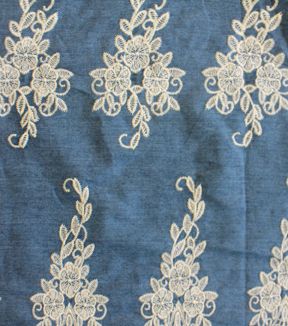 an old blue cloth with white lace on it