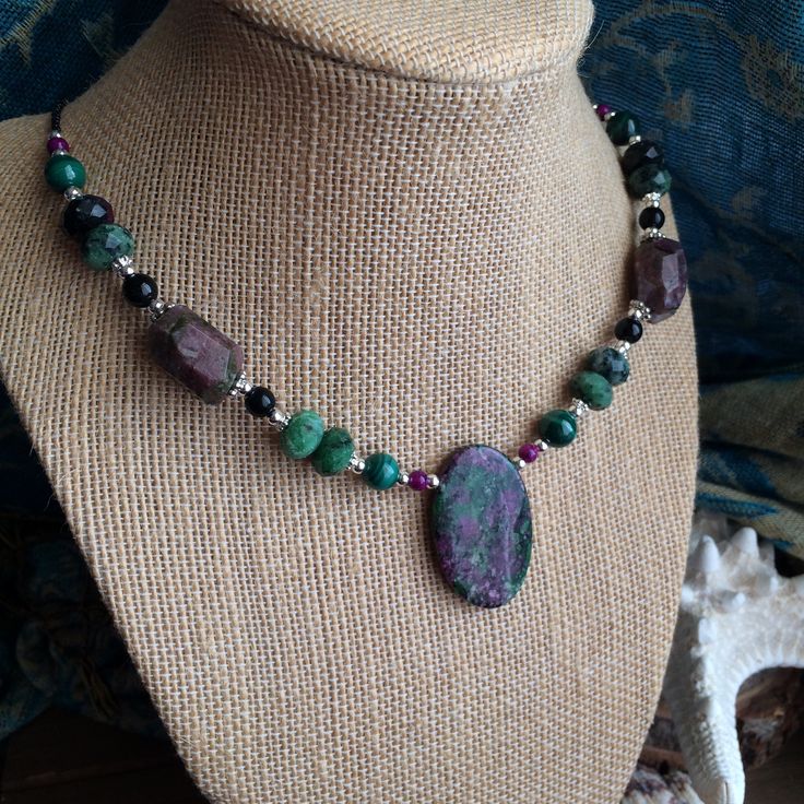 Stone necklace set green oval zoisite pendant necklace malachite gemstone boho necklace watermelon tourmaline tribal set unique jewelry for women, SLD Ruby in zoisite is such a neat stone. It's said to alter ones consciousness and give you access to your soul and memory. The mineral name for this stone is Anyolite and is mined in Tanzania. 30mm ruby in zoisite stone, oval. 8mm malachite gemstone beads raspberry fossil coral, 16mm faceted Ruby in zosite, 20mm watermelons tourmaline natural stone Bohemian Green Gemstones For Jewelry Making, Jewellery Beads, Ruby In Zoisite, Stone Necklace Set, Anklets Boho, Stone Dangle Earrings, Green Oval, Gold Headband, Redondo Beach