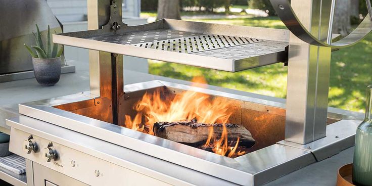 a fire pit sitting on top of a metal grill