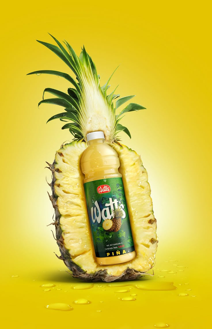 a pineapple with a bottle of juice in the shape of a pineapple on a yellow background