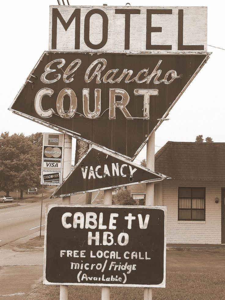 an old motel sign has been altered to look like it is in black and white