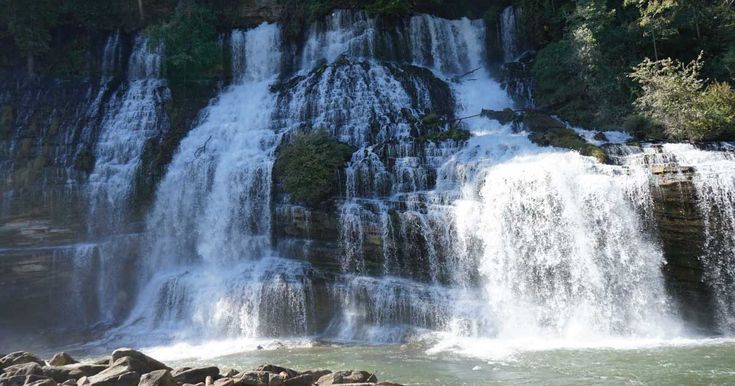 there is a waterfall that has water cascading over it