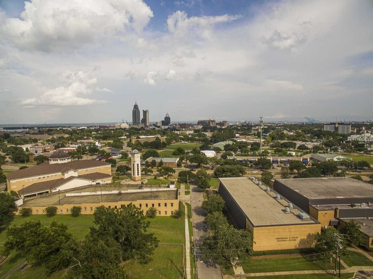 an aerial view of a city with buildings and trees