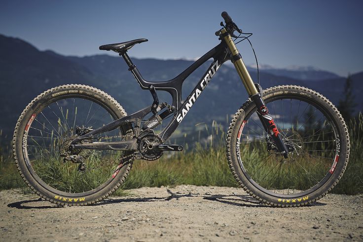 a mountain bike parked on top of a dirt road