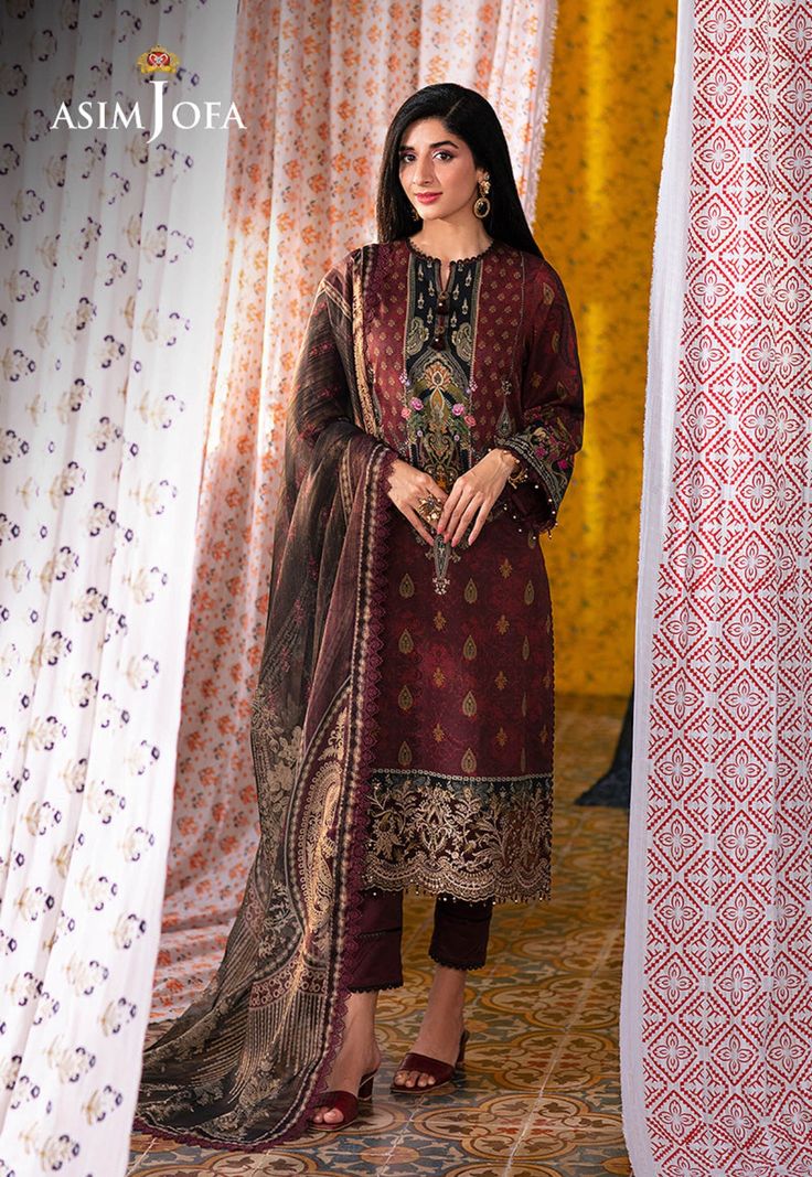 Shirt: Lawn By Pcs: 3 Pcs Trouser: Cambric Dupatta: Mehsuri Color: Maroon Product Details Enter a world of timeless beauty with our maroon ensemble from the "Aira - Summer Printed Collection," a tapestry woven with threads of tradition and charm. The embroidered daman border is a cascade of sequins each one a glimmering reminder of the stars that adorn the night sky. The digital printed shirt is a canvas painted with bold color traditional motifs each stroke a homage to the richness of heritage. Traditional Salwar Suits, Pakistani Lawn Suits, Winter Shawl, Pakistani Salwar Kameez, Party Kleidung, Maria B, Lawn Suits, Pakistani Outfits, Fabric Stores Online