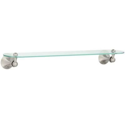 a glass shelf with two balls on it