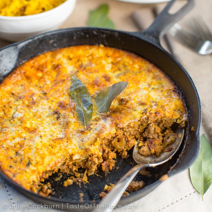 a close up of a skillet with food in it