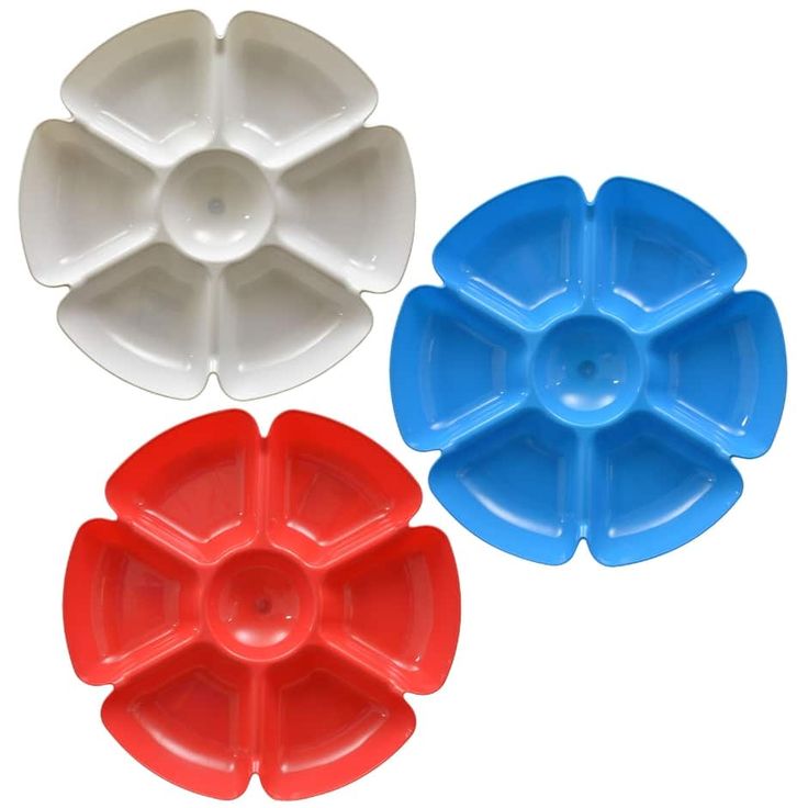 three pieces of plastic cake pans in different colors