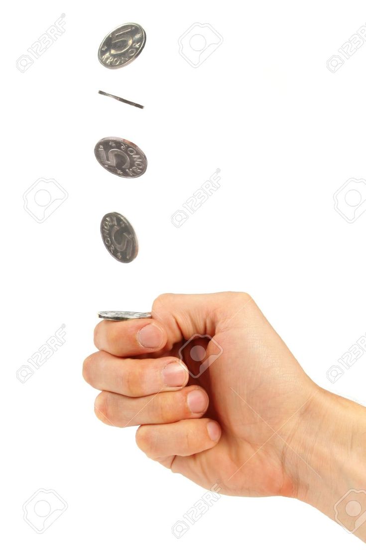 a hand throwing coins into the air on white background stock photo - 957982