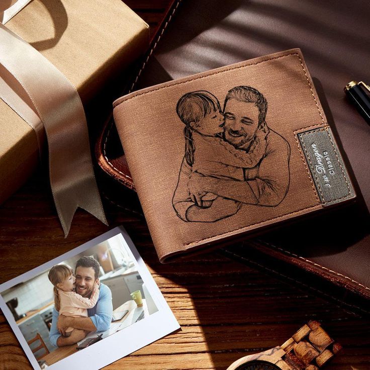 a wallet with a drawing of a man and woman on it next to a photo