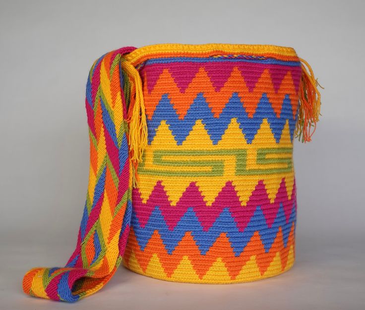 Mochila purse made by artisans of the Wayuu Indigenous Group in Colombia Purchased directly from Artisan, on a Fair Trade Basis Fully Handmade For each Wayuu Mochila Bag purchased, Hands of Colombia donates thread to Indigenous Artisans. Only ONE available Add a touch of indigenous craftsmanship to your style with our Luniqizieuqi Wayuu Handmade Mochila Purse. Each purse is meticulously handmade by skilled artisans from the Wayuu Indigenous Group in Colombia. Hands of Colombia purchases each ite Artisan Multicolor Shoulder Bag With Adjustable Strap, Traditional Multicolor Bag With Removable Pouch, Traditional Multicolor Bags With Removable Pouch, Multicolor Bucket Bag With Removable Pouch, Multicolor Rectangular Bucket Bag With Adjustable Strap, Traditional Multicolor Bag With Adjustable Strap, Multicolor Rectangular Pouch With Adjustable Strap, Traditional Multicolor Shoulder Bag With Removable Pouch, Multicolor Handheld Bag For Gift