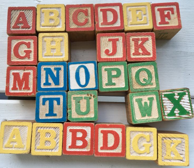 wooden blocks with letters and numbers on them