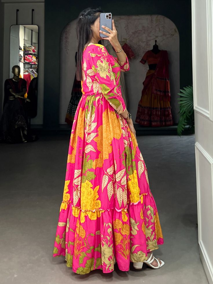 Introducing our mesmerizing pink floral printed silk festival wear gown, a stunning addition to your wardrobe for any special occasion. This fully stitched gown is made from luxurious silk fabric with intricate floral print work, making it a standout piece for festivals, events, or any function. The pink color adds a touch of femininity and elegance, while the 5-meter flair and 55-inch length create a graceful silhouette that is sure to turn heads.
When you wear this pink gown, you'll feel like Silk Saree With Digital Print, Silk Maxi Kurta With Floral Print, Silk Maxi Dress With Printed Motifs, Silk Kurta With Floral Print In Maxi Length, Silk Anarkali Set With Floral Print, Floor-length Floral Print Anarkali Set For Navratri, Floral Print Saree Dress For Summer, Floral Print Floor-length Anarkali Set For Navratri, Floor-length Floral Anarkali Set For Navratri