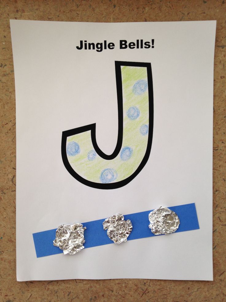 the letter j is made up of two pieces of paper and some silver foil on top of it