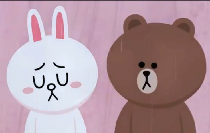 two brown and white teddy bears standing next to each other in front of a pink background