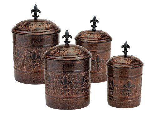 three brown canisters with crosses on the top and one has an iron lid