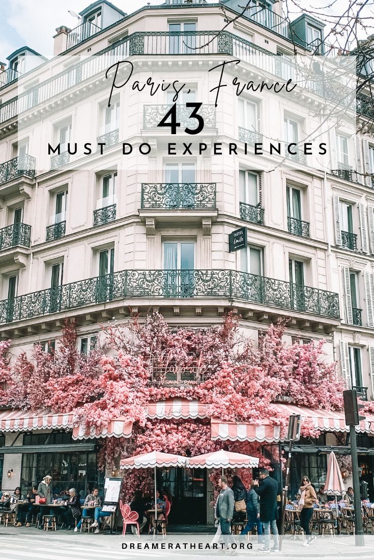 the front of a building with pink flowers on it and text overlay that reads paris france must do experiences