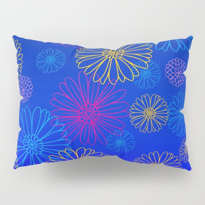 a blue pillow with colorful flowers on it