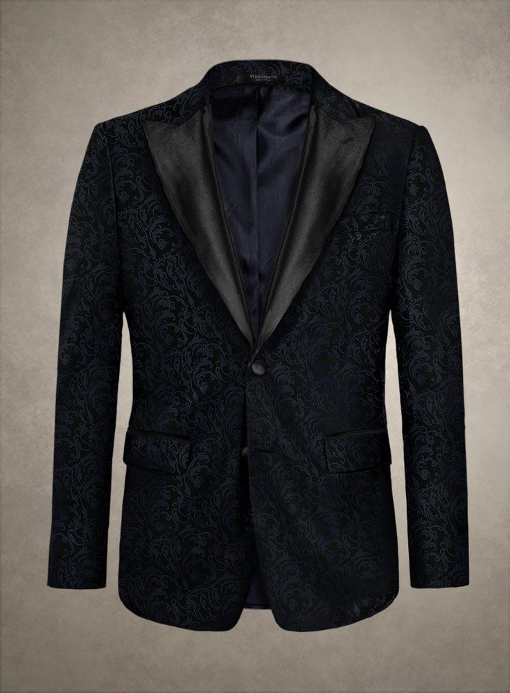 Experience the essence of luxury with our Italian Morbido Tuxedo Blazer. Masterfully tailored from premium polyester fabric, this distinguished piece is a testament to exquisite craftsmanship and sartorial elegance. As it adorns you, feel the embrace of its luxurious texture and the captivating charm it brings. The deep blue hue, enhanced with subtle yet captivating patterns, sets this blazer apart as an icon of style, transforming every appearance into an event of unparalleled sophistication. Ideal for gala evenings or exclusive gatherings, this versatile masterpiece adds a touch of class and refinement to your collection.  An elusive unique piece from our Red Carpet Collection.   Look features a 2 button tuxedo jacket with black cherry satin wide peak lapel, matching satin covered button Elegant Fitted Suit For Formal Occasions, Classic Custom-fit Blazer For Parties, Classic Party Blazer With Custom Fit, Elegant Custom Fit Suits With Hidden Button Closure, Elegant Custom Fit Suits For Formal Events, Classic Custom Fit Party Blazer, Classic Custom Fit Blazer For Party, Elegant Tailored Suit, Elegant Black Tuxedo With Lapel Collar