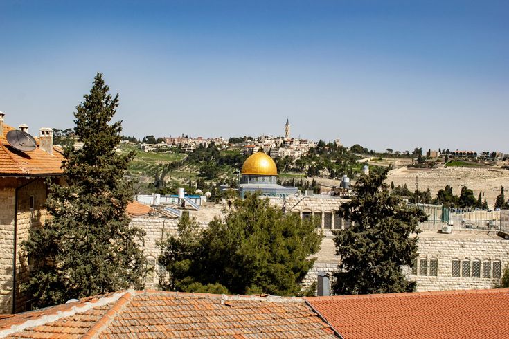 the dome of the rock on top of a building in the middle of an old city