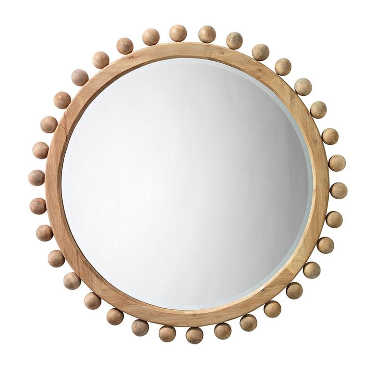 a round mirror with wooden balls around it