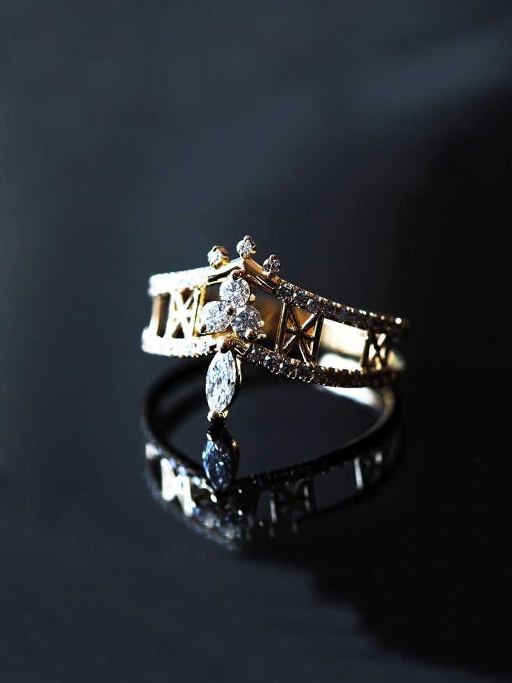 a close up of a ring on a black surface