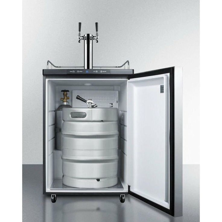 an open refrigerator with two kegs in it