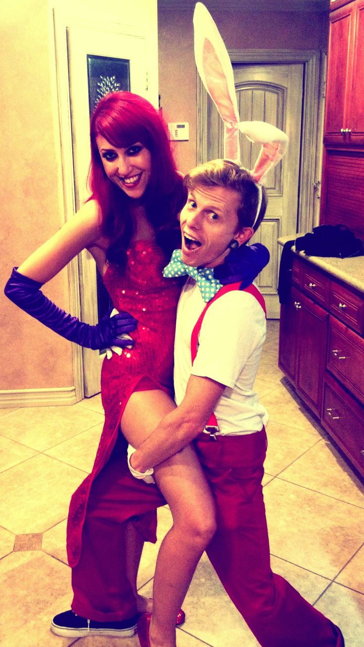 a man and woman dressed up in bunny ears posing for a photo with each other