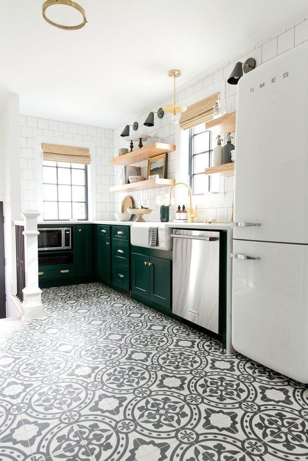 a white refrigerator freezer sitting inside of a kitchen next to a stove top oven