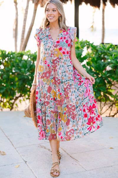 It's another day to look and feel your best! May we suggest throwing this adorable midi on! That floral print and those fun springy colors are the perfect combination! That tiered fit is really nice and flowy making this midi great for warm weather! Plus, we love a dress that look just as good with wedges as it does sneakers! This midi dress features short flutter sleeves, a v-neckline with a partial button down detail, ditsy floral print, and a tiered body. Material has no amount of stretch.Cam Spring Vacation Short Sleeve Maxi Dress, Flowy Tiered Midi Dress Casual Style, Flowy Tiered Midi Dress Casual, Flowy Tiered Casual Midi Dress, Summer Ditsy Floral Print Midi Dress, Multicolor Floral Patchwork Maxi Dress For Spring, Spring Multicolor Floral Patchwork Maxi Dress, Spring Beach Floral Dress With Ruffles, Spring Daytime Printed Dresses