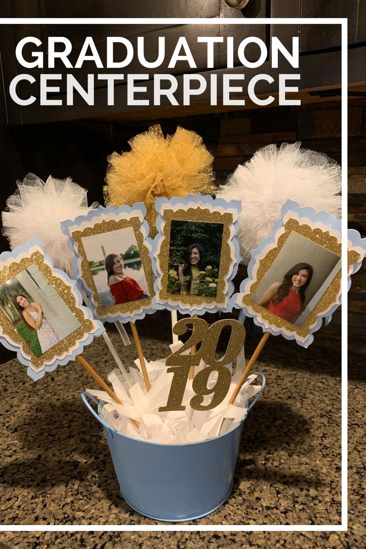 graduation centerpieces in a bucket with pictures on them and the words, congratulations