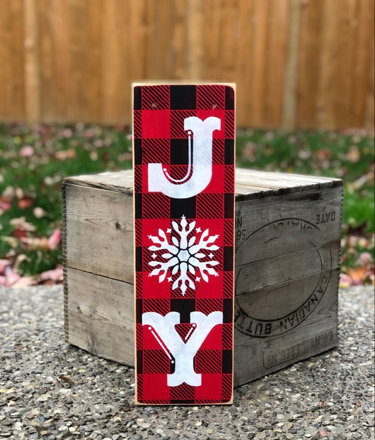 a wooden block with the letter y painted on it