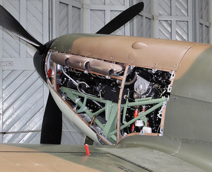 an old airplane is parked in a hanger