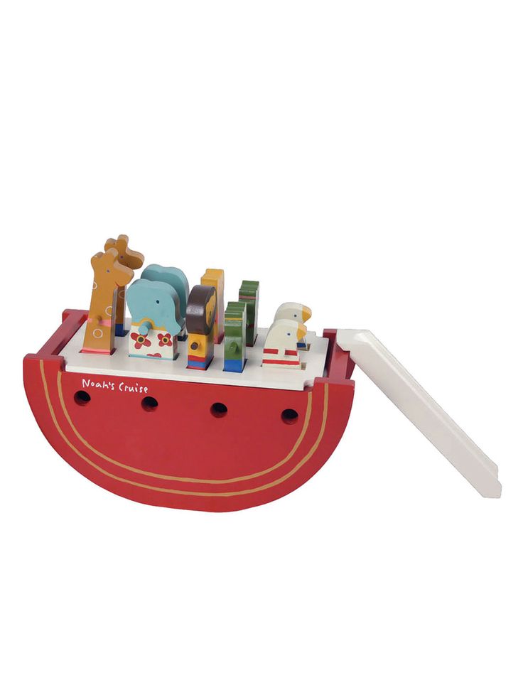 a wooden toy boat with animals and other toys on it's front end, in the shape of a noah ship