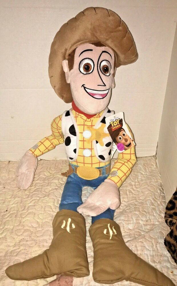 a stuffed toy sitting on top of a bed