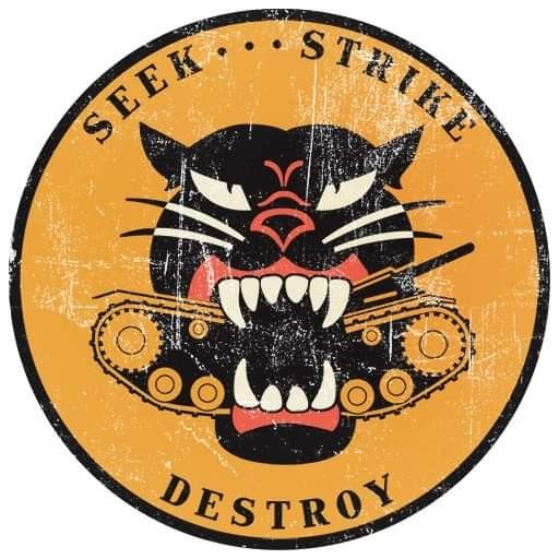 a black and yellow sign with an angry cat on it's face that says seek strike destroy