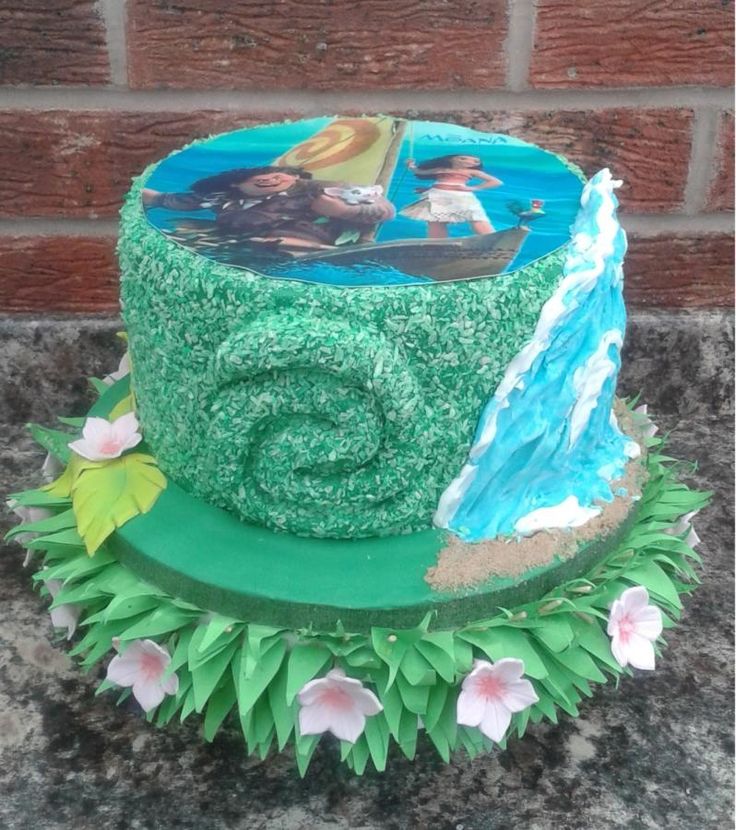 a cake decorated with the theme of disney's princess and the frog