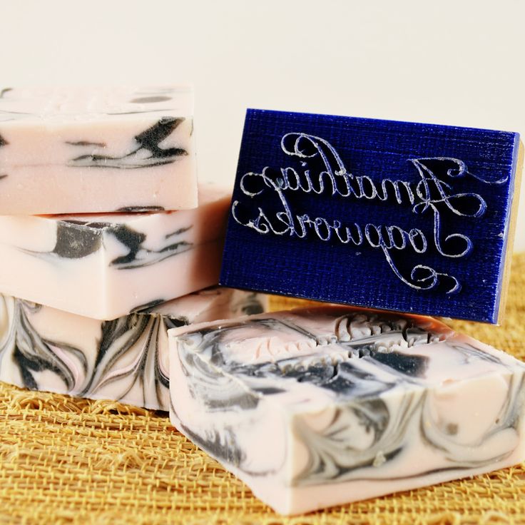 three handmade soap bars sitting next to each other on top of a burlly cloth