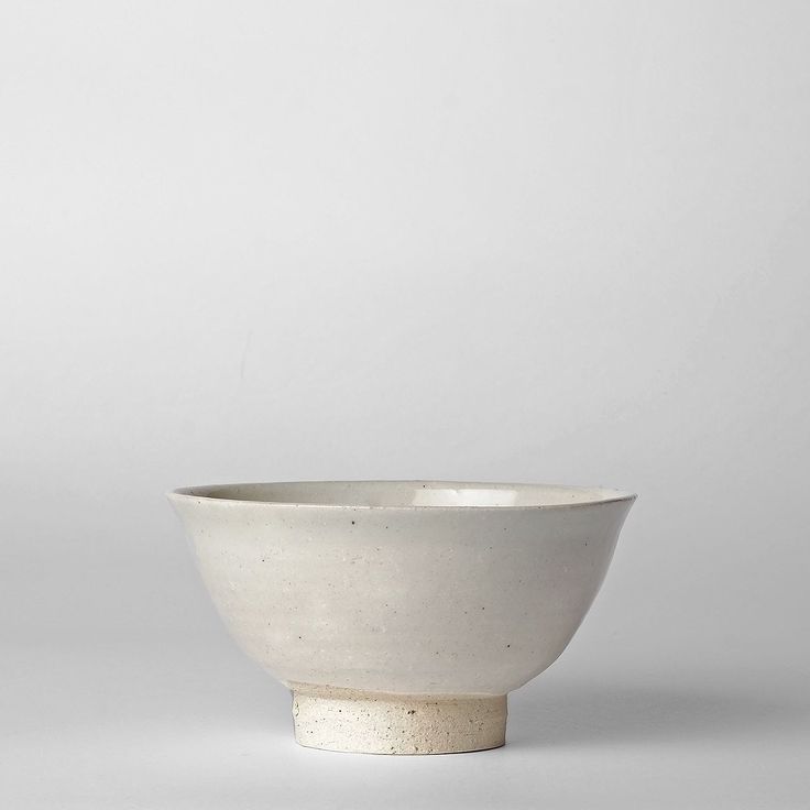 a white bowl sitting on top of a table