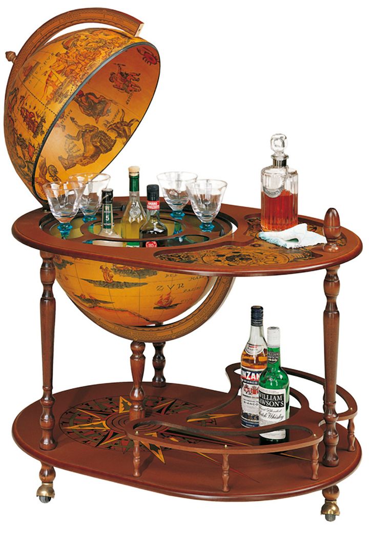 an antique globe bar cart with drinks on it