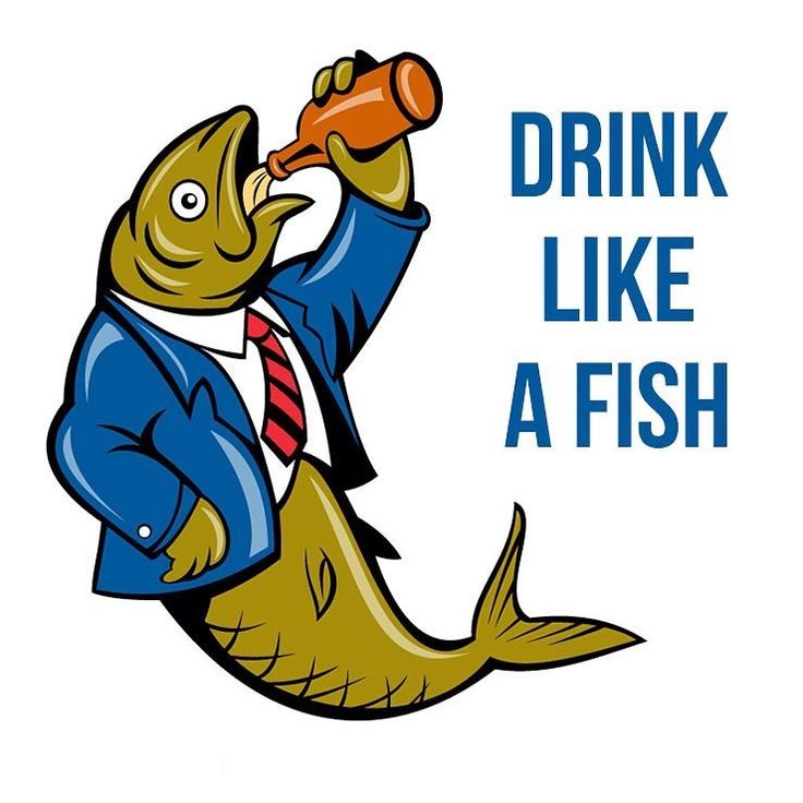 a man in a business suit drinking from a bottle while standing on a fish tail