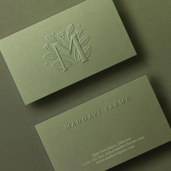 two business cards sitting on top of each other with the words madhat farm printed on them